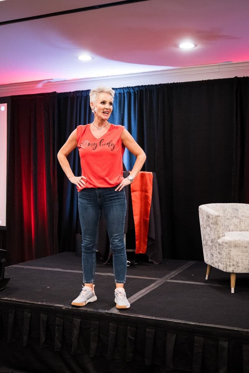 Linda Paige leading a session on stage at Linda Paige Live