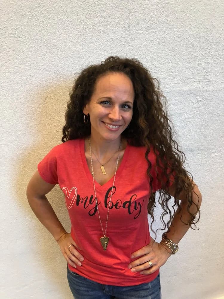 A woman wearing her I Love My Body shirt