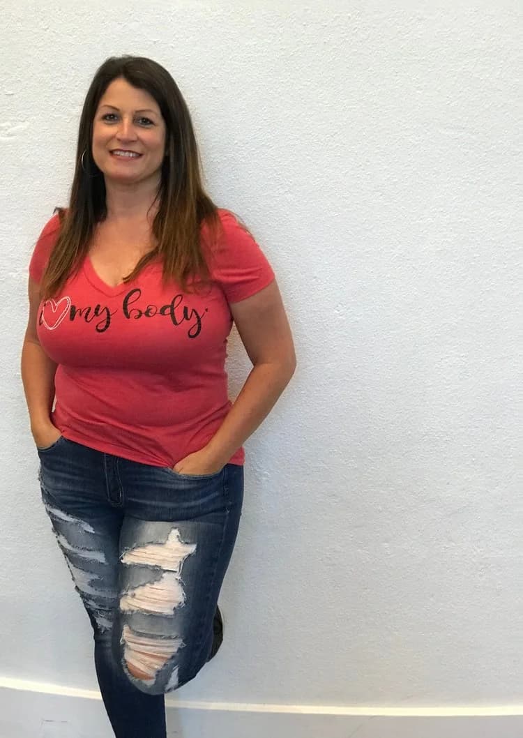 A woman wearing her I Love My Body shirt