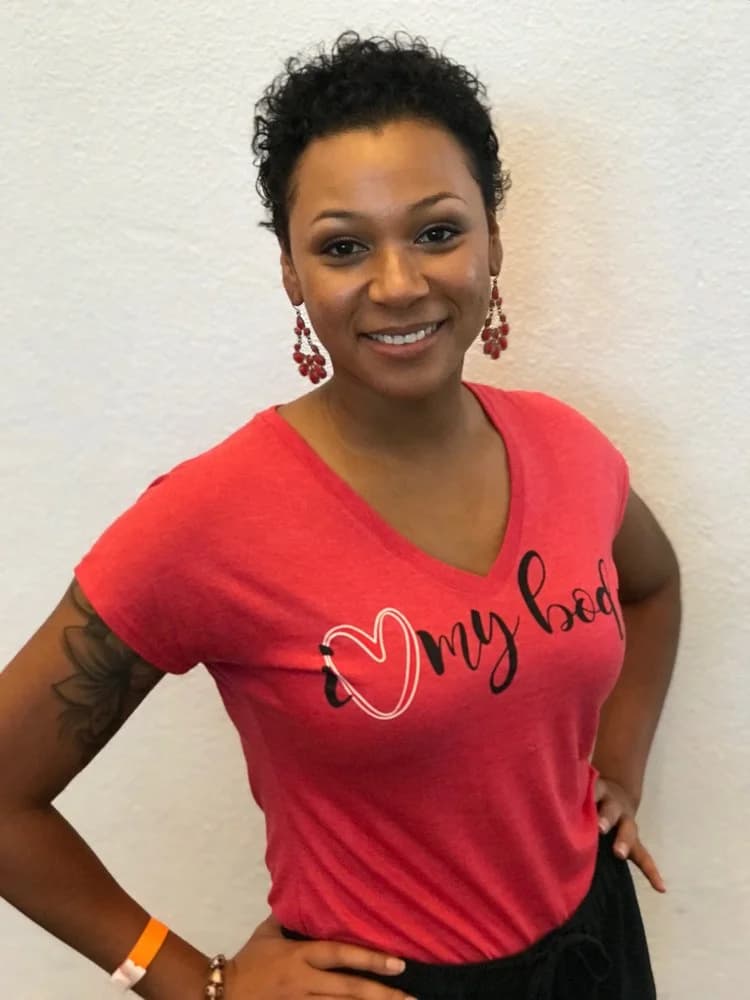 A woman wearing her I Love My Body shirt