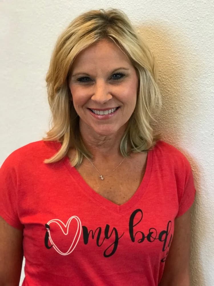 A woman wearing her I Love My Body shirt
