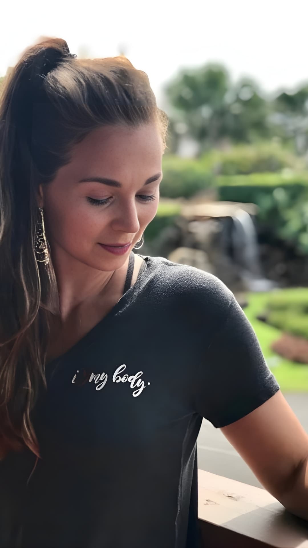 A woman wearing her I Love My Body shirt