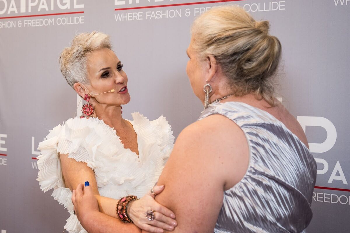 Linda Paige embracing an attendee at LP Live 2024